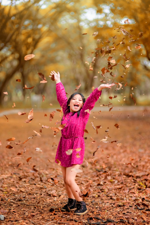 Toddler laughing outdoors